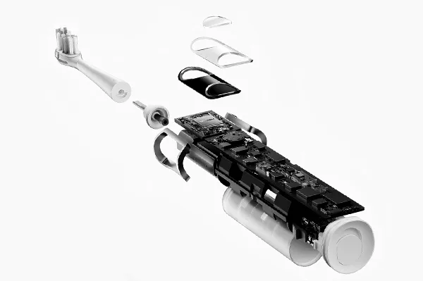 Exploded view of an electric toothbrush demonstrating precision tooling and mold design for complex shapes.