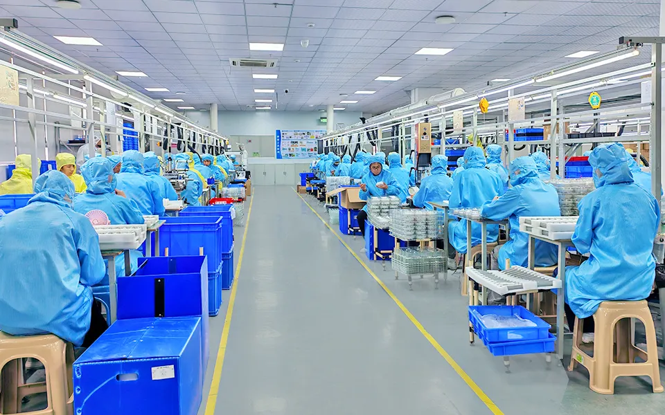 Workers assembling oral care products along Relish's production lines.